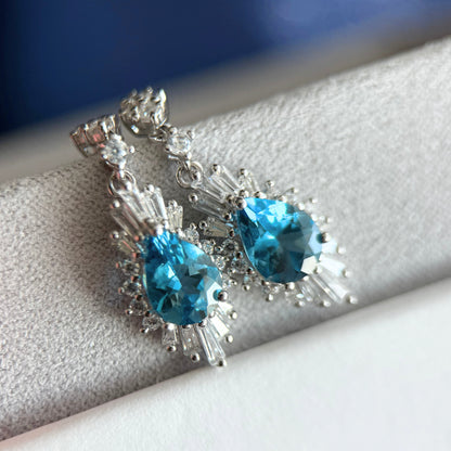 Luminous Natural Blue Topaz Halo Drops – Sterling Silver